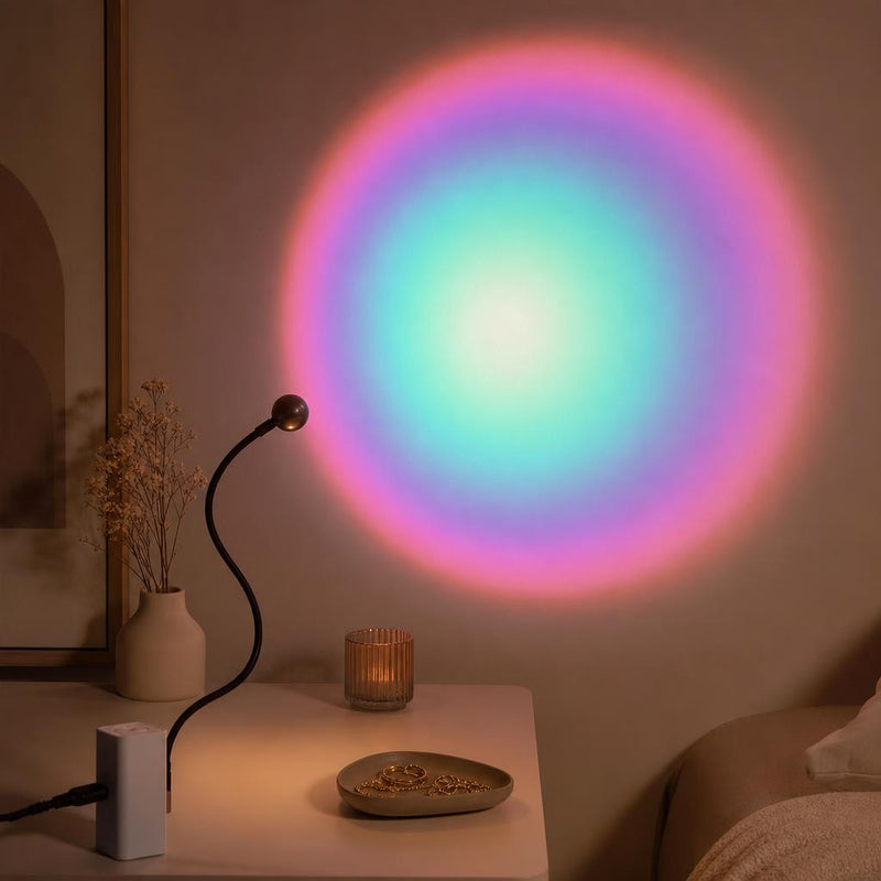 Lámpara Lumé proyectando un aura arcoíris en la pared de una recámara aesthetic